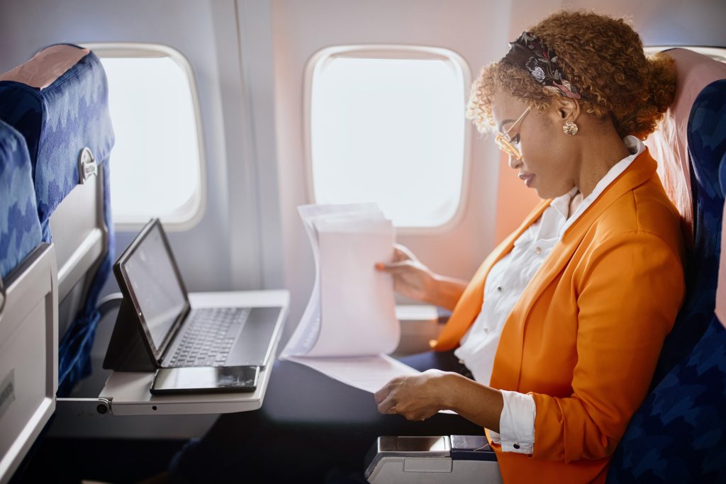 Businesswoman considering tax obligations for working or living abroad.