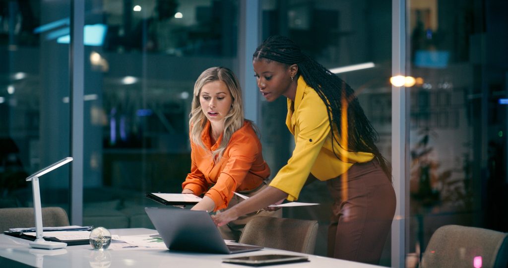 Business people discussing research and experimentation expenses over a business desk